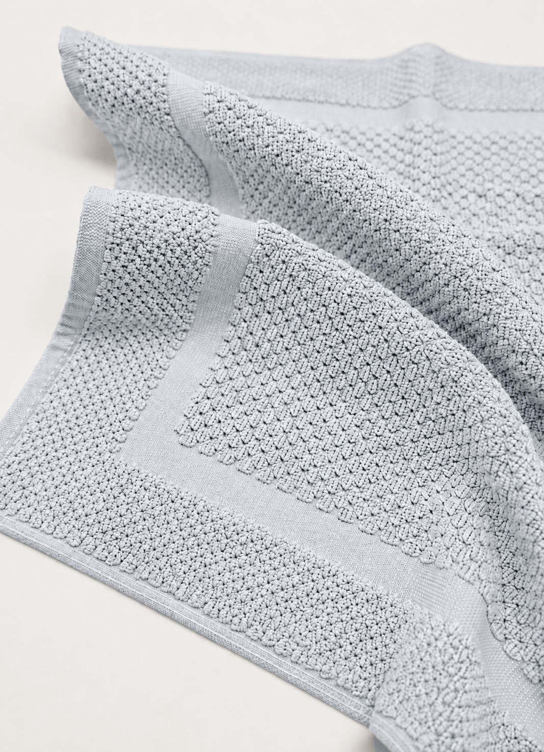 Haven bath mat in Silver Mist — close-up of raised woven detail and tailored border