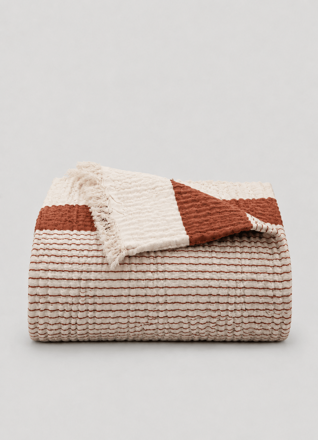 Aurea Muslin coverlet in Clay — hero shot of featherlight Turkish cotton muslin