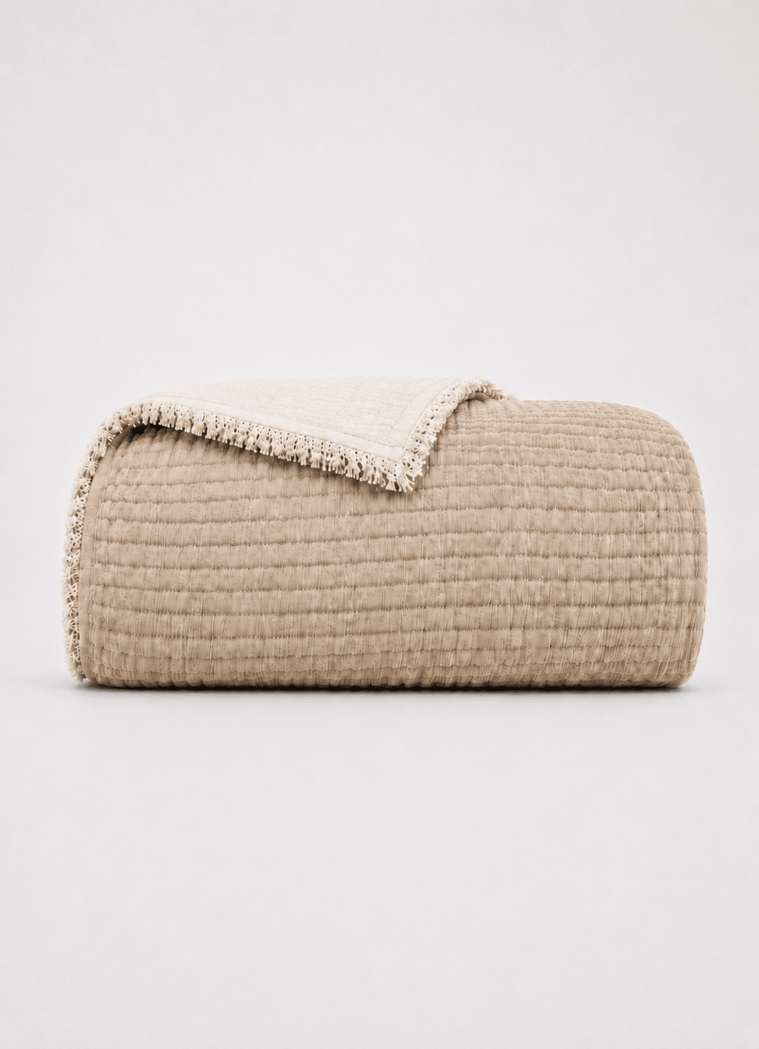 AirWeave Muslin coverlet in Dune — hero product shot of lightweight layering coverlet