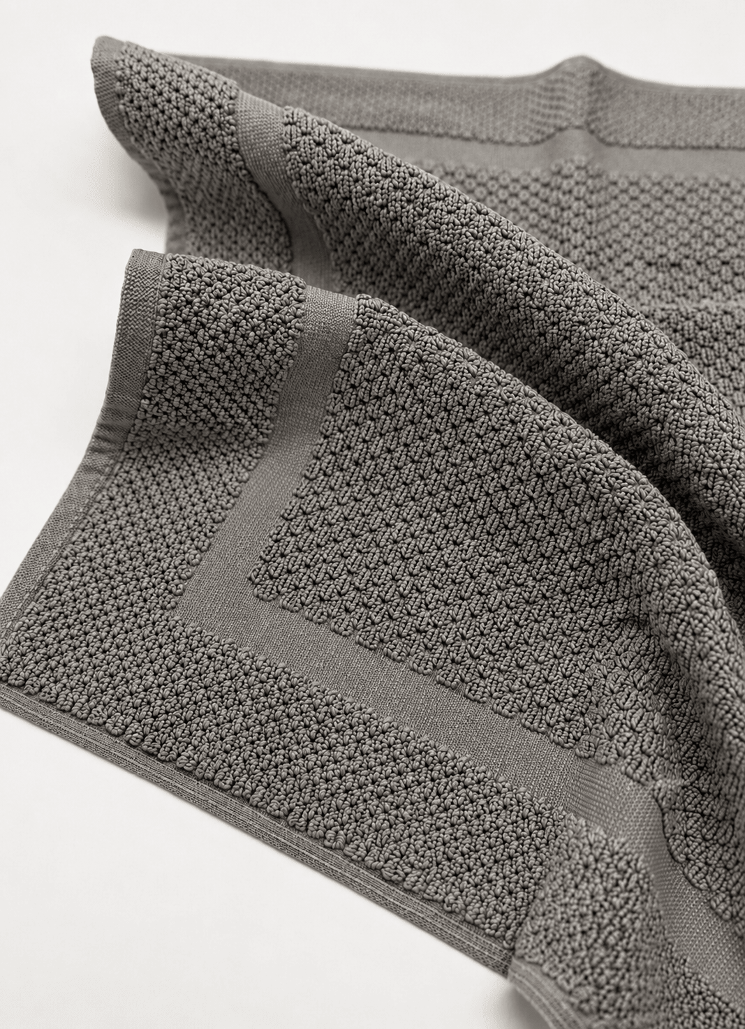 Haven bath mat in Slate Grey — close-up of woven texture and tailored border