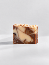 Calinea Botanical Soap Bar in Honey & Almond — a cream and cocoa-brown swirled cold-process bar with a honeycomb-textured top, handmade in Türkiye