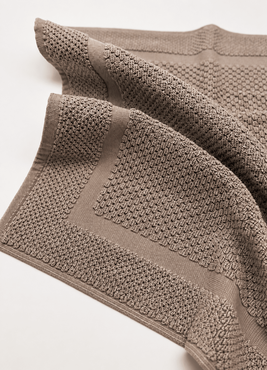Haven bath mat in Dune Taupe — angled view showing plush texture and finish