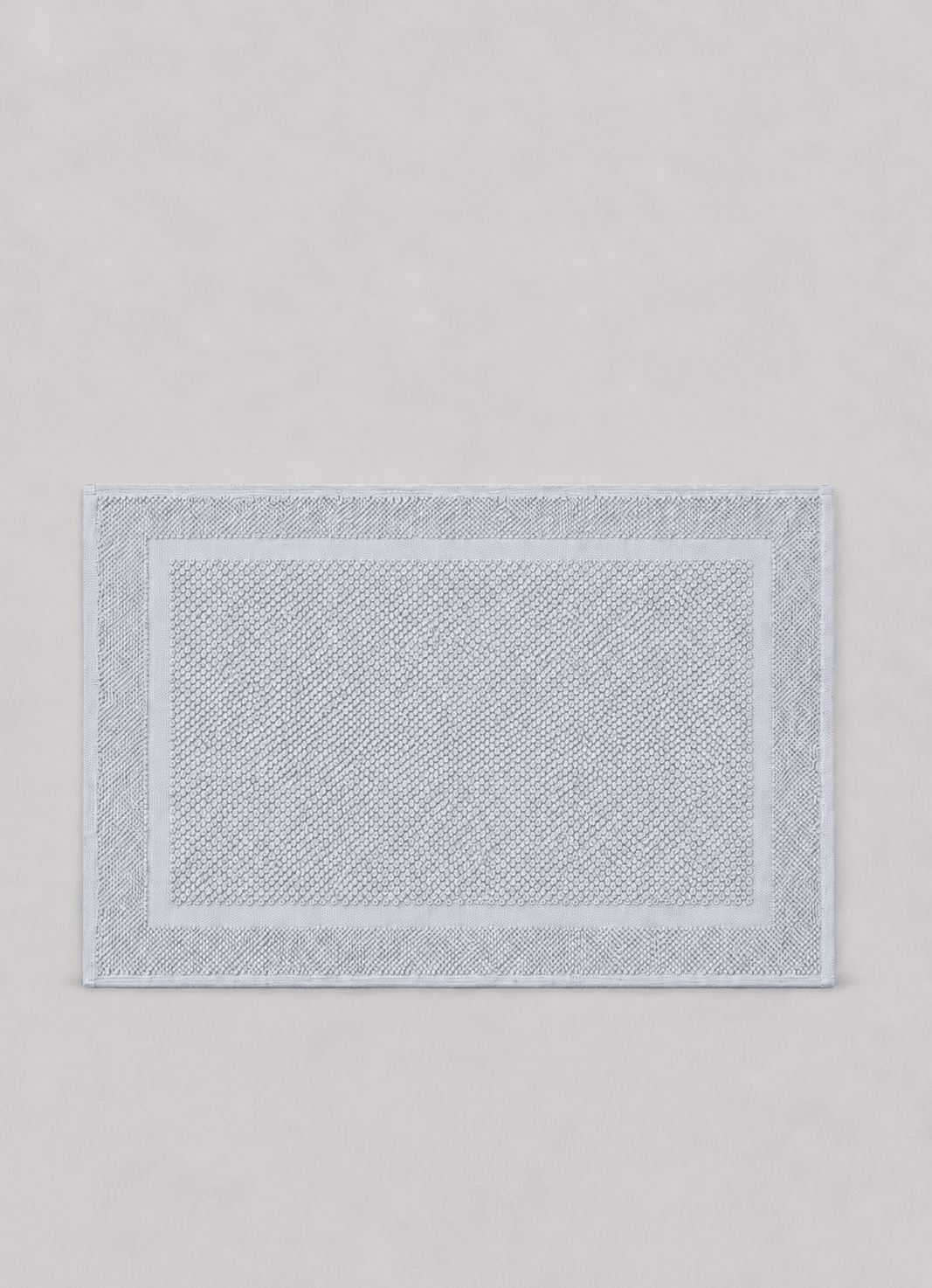Haven bath mat in Silver Mist — hero shot of richly woven Turkish cotton with raised detailing