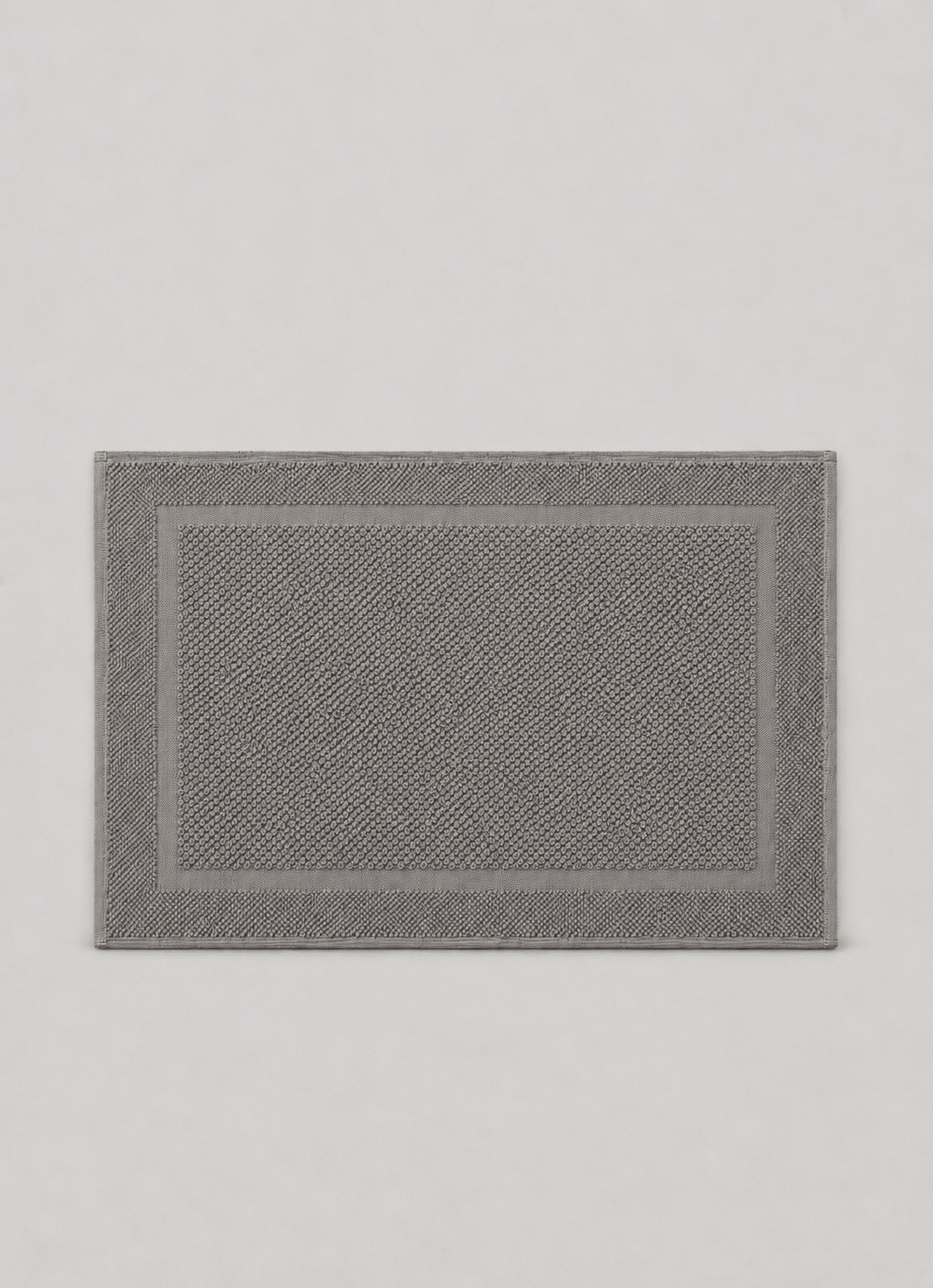 Haven bath mat in Slate Grey — hero shot of spa-inspired Turkish cotton bath mat