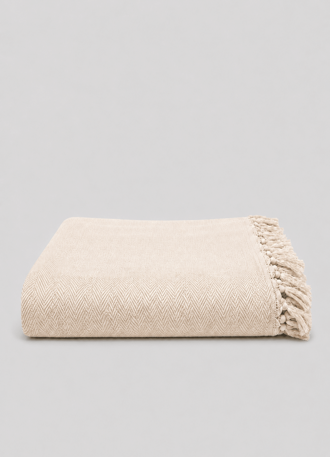 Heritage Weave Herringbone throw in Alabaster — hero shot of handwoven Turkish cotton