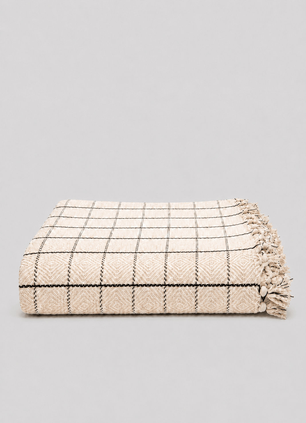 Heritage Weave Windowpane throw in Oat Veil — hero shot of handwoven Turkish cotton