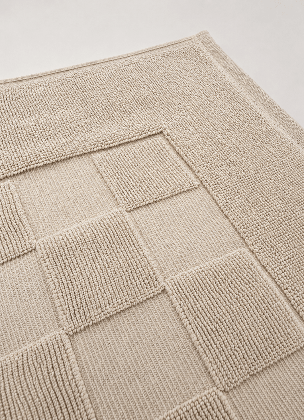 Marlow Check bath mat in Alabaster — lifestyle shot in bathroom setting