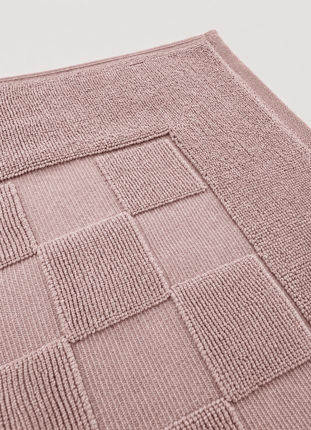 Marlow Check bath mat in Blush Stone — close-up of checker pattern and raised border