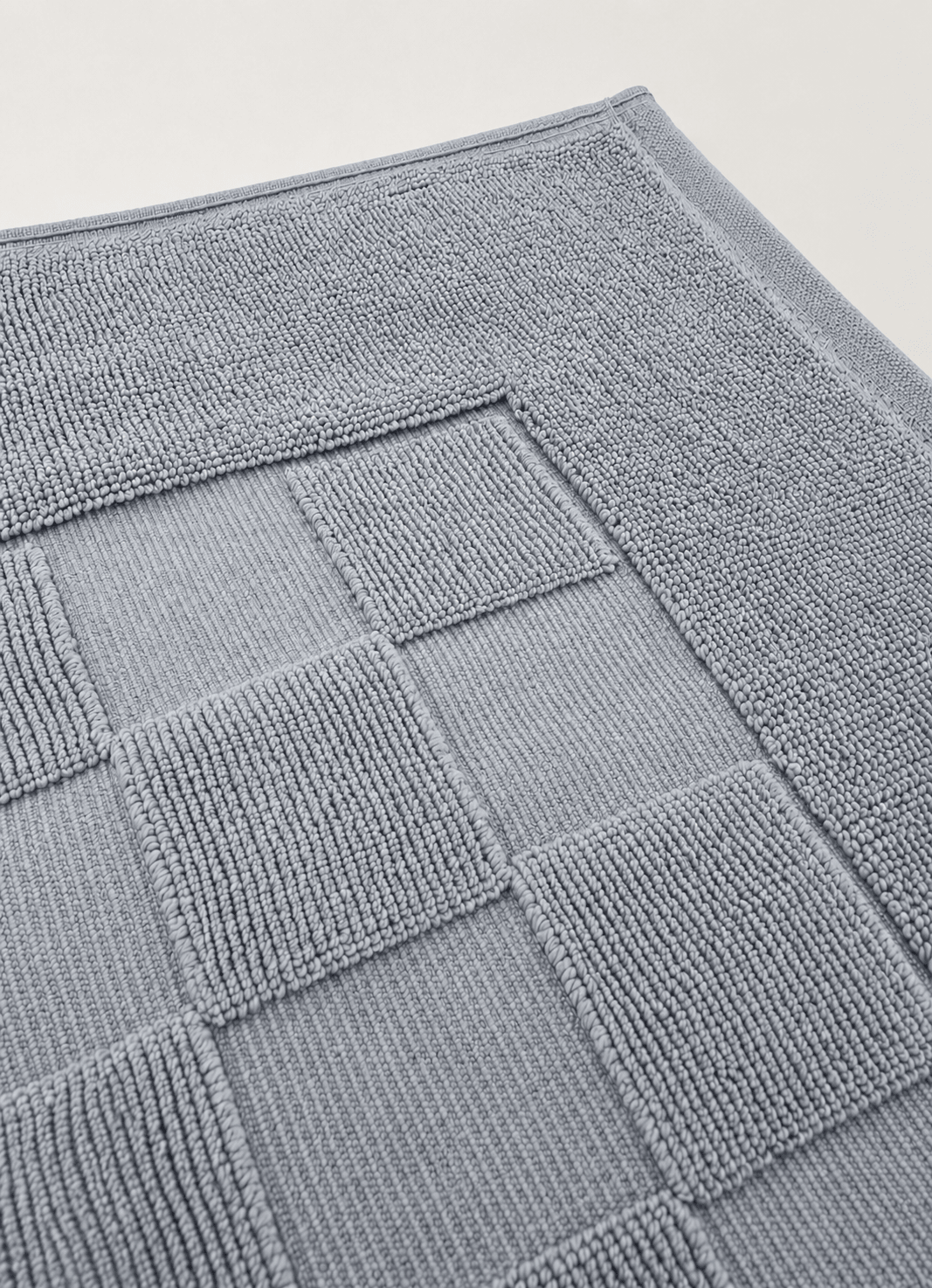 Marlow Check bath mat in Coastal Slate — lifestyle shot in styled bathroom