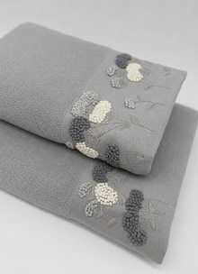 Florence Heirloom towel in Mineral — close-up of smooth Turkish cotton weave and embroidery detail
