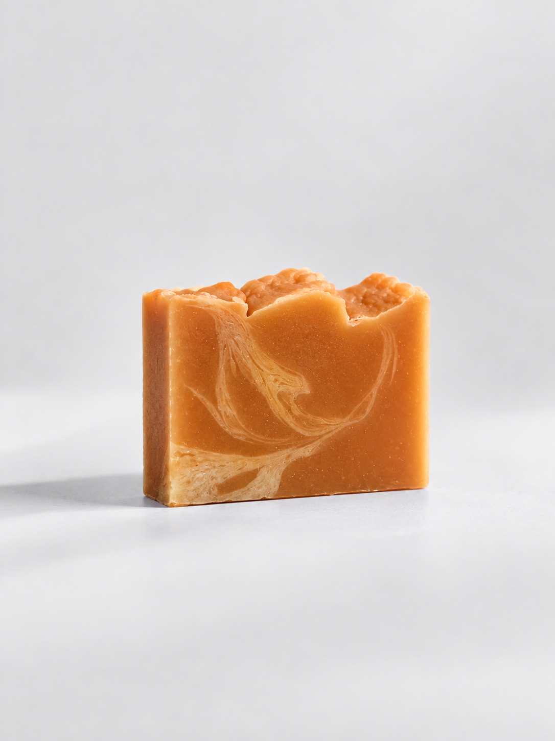 Calinea Botanical Soap Bar in Apricot Kernel Oil — a warm amber cold-process bar swirled with cream, handmade in Türkiye
