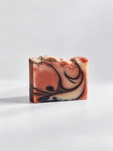 Calinea Botanical Soap Bar in Argan — a cream cold-process bar marbled with rose and dark swirls, handmade in Türkiye