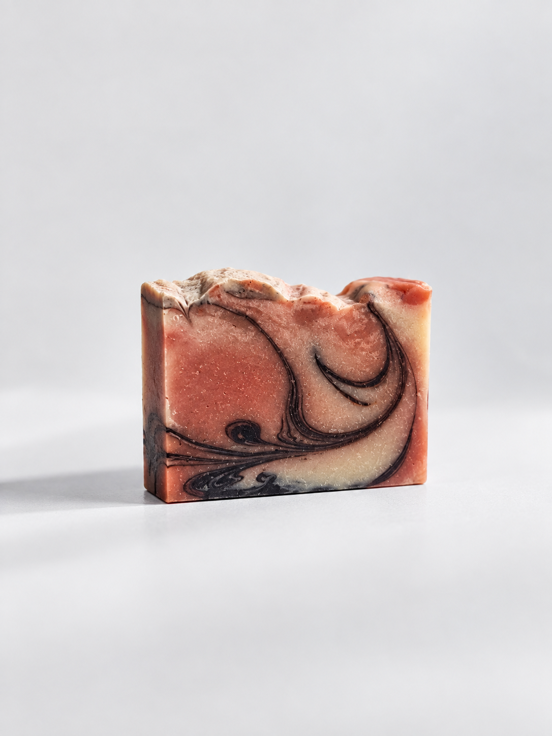 Calinea Botanical Soap Bar in Argan — a cream cold-process bar marbled with rose and dark swirls, handmade in Türkiye