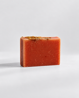 Calinea Botanical Soap Bar in Jasmine — a terracotta cold-process bar scattered with dried botanicals, handmade in Türkiye