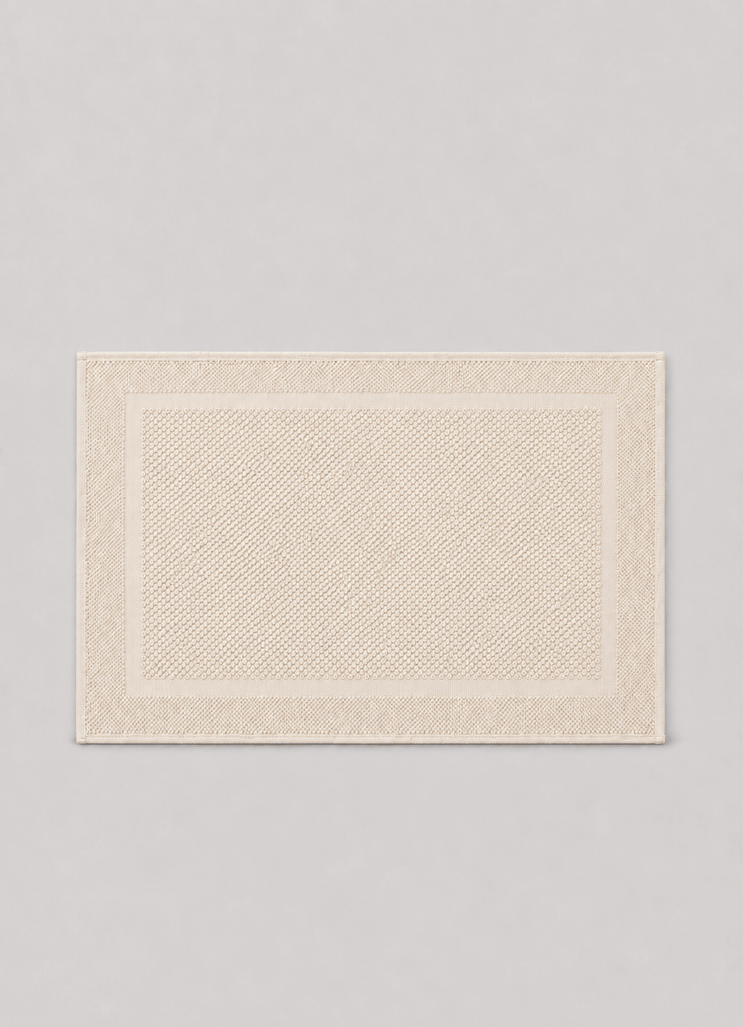 Haven bath mat in Alabaster — hero shot of richly woven Turkish cotton