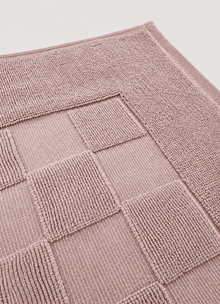 Marlow Check bath mat in Blush Stone — close-up of checker pattern and raised border
