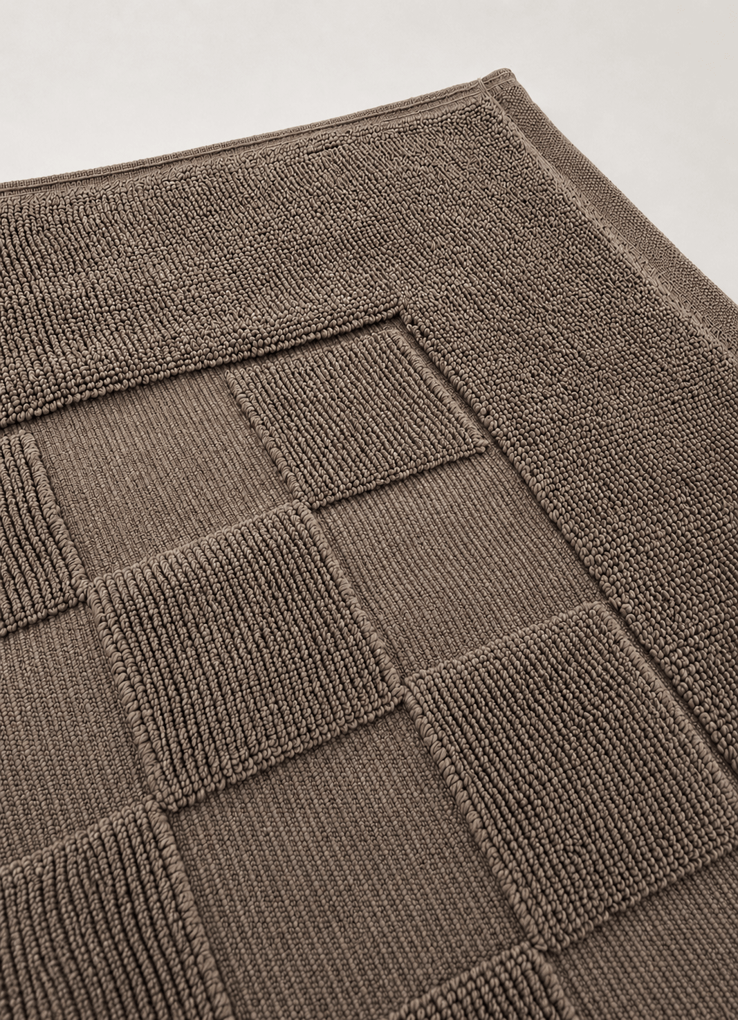 Marlow Check bath mat in Driftwood Taupe — lifestyle shot in styled bathroom